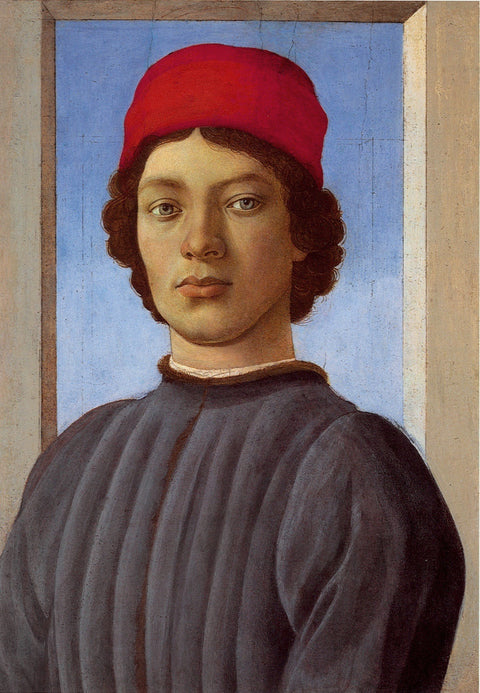 Portrait d’un jeune homme avec le bouchon rouge